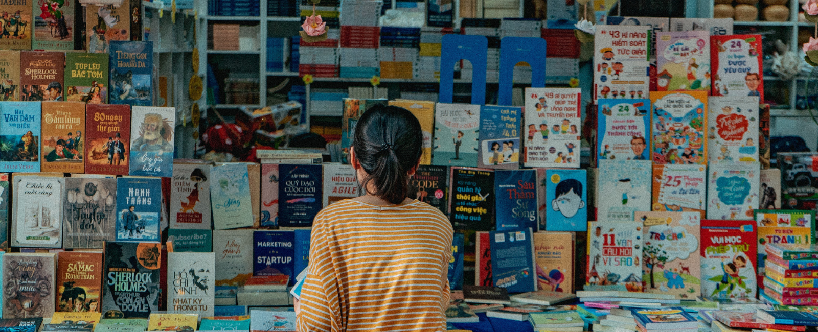 Person looking at looks on Ho Chi Minh's Book Street